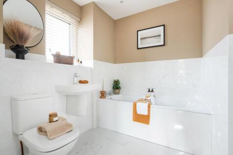 Picture a relaxing dip in this stylish bathroom