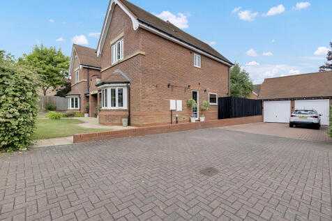 Driveway for six cars and double detached garage