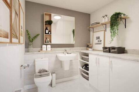 A guest cloakroom also hosts space for laundry appliances