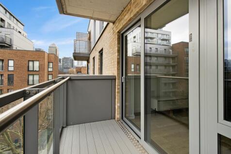Experience urban living with a view at this modern apartment balcony.