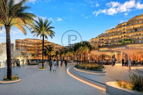 A vibrant coastal promenade with palm trees, moder