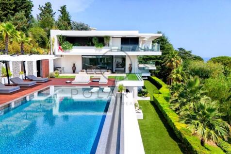 Modern luxury villa with a large swimming pool, su