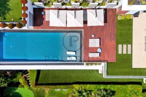 Aerial view of a modern backyard with a rectangula