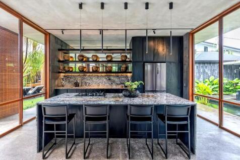 Modern kitchen with an island, sleek black cabinet