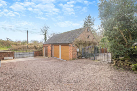 Triple Garage and Driveway