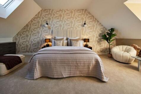 Large windows flood Bedroom 1 with natural light