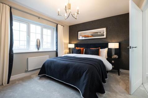 The main bedroom features large windows