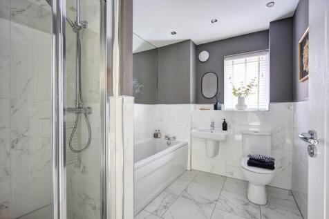 A practical family bathroom with both shower, and bath