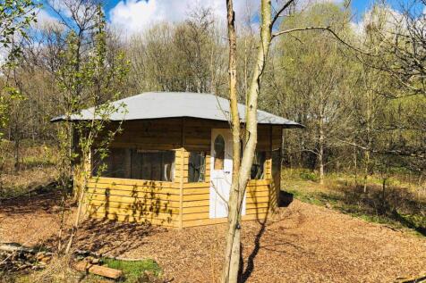 Summer house with wood burner