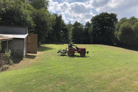Meadow with large barn