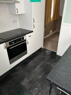 Kitchen area/leading onto bedroom