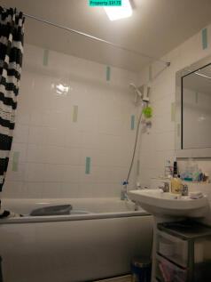 Bathroom: Basin, toilet, bath and shower over bath