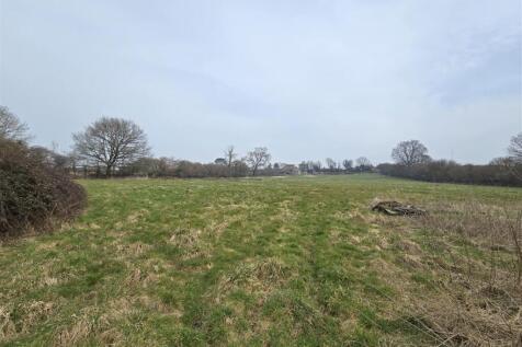 Land facing house