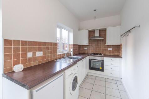 Bayed sitting room and fitted kitchen
