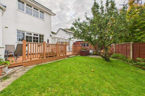 Spacious garden to the rear of the property with decking and fruit trees