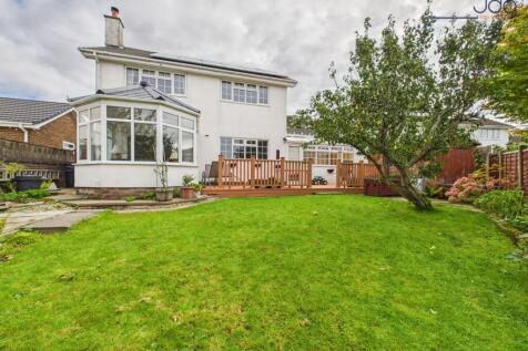 Spacious garden to the rear of the property with decking and fruit trees