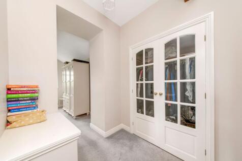 BEDROOM ONE WALK-IN WARDROBE / DRESSING AREA