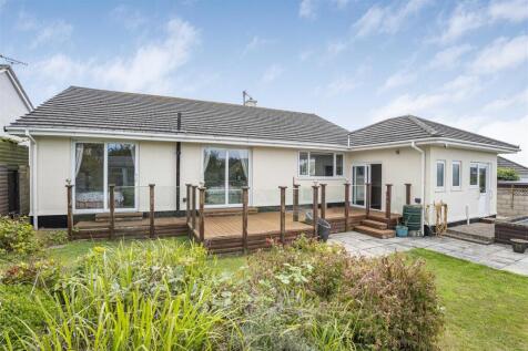 OUTSIDE TO THE REAR OF THE PROPERTY