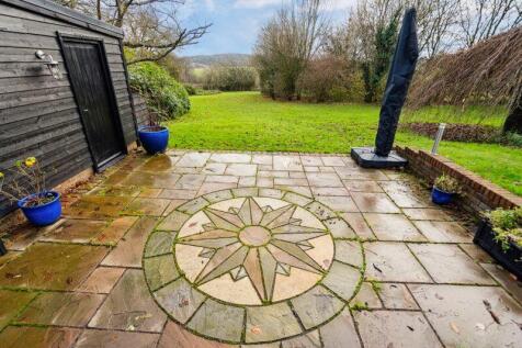 Ornate patio adjacent to garage