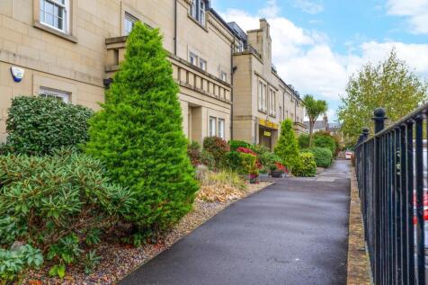 Pedestrian walkway and well-maintained gardens
