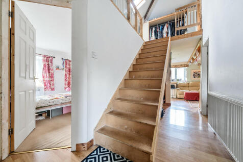 Hallway with stai...