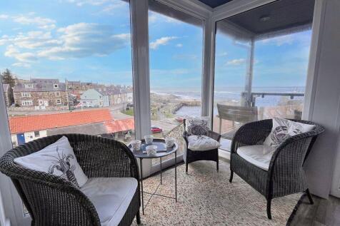 Kitchen seating area with sea views