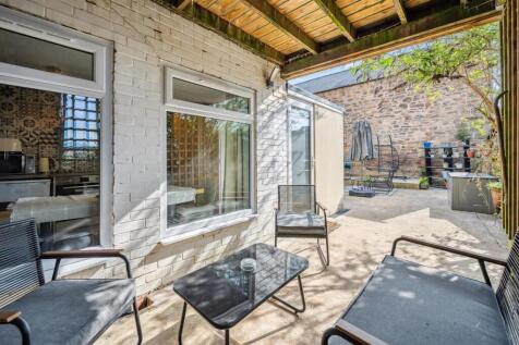 Covered dining patio to courtyard garden.jpg