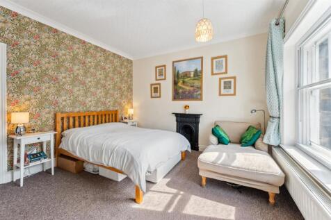 Bedroom One - bed and fireplace.jpg