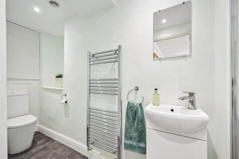 Bedroom One en-suite - WC and vanity unit.jpg