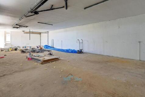 garage with area pre-plumbed for laundry