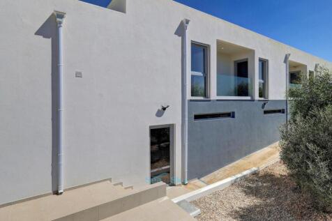 garage with bedrooms above