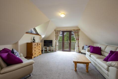 2 bed upstairs lounge with balcony