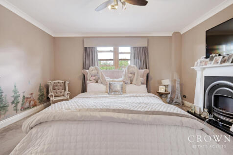 Bedroom Three with Feature Fireplace and fitted wa