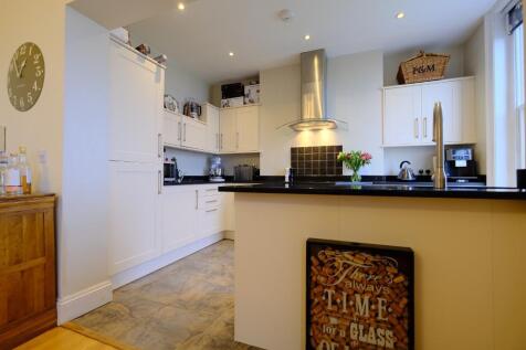 Open plan kitchen with breakfast bar