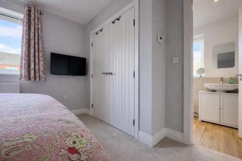 Main bedroom with fitted wardrobe
