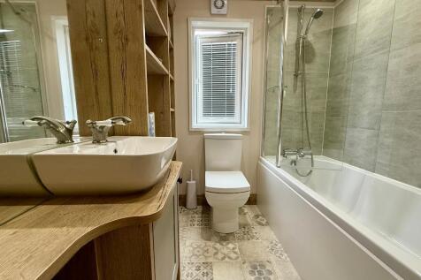 Modern bathroom with shower over