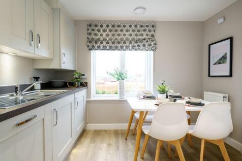 A bright and airy kitchen and breakfast area