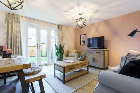 Double doors lead from a spacious lounge to the garden