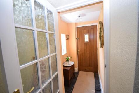 Entrance lobby opening to the:-