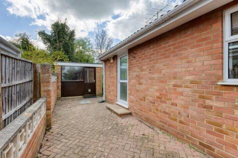 Block paved area to side