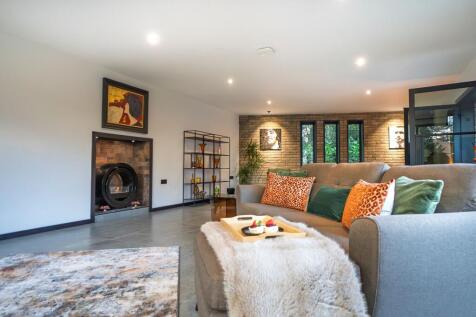 Large lounge with exposed brick...