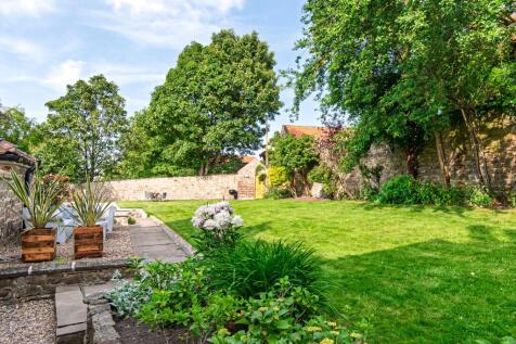 Sunny terrace and lawned area