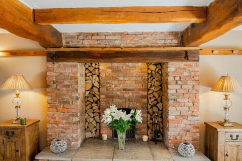 Picturesque large fireplace in the Lounge