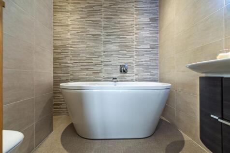 Large statement bath in the Family Bathroom