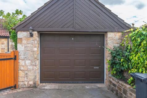 Detached garage with power, lighting and additional mezzanine level for storage