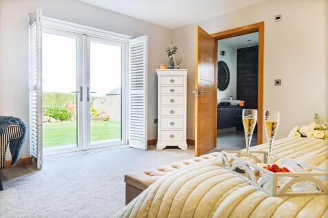 Patio doors onto the garden from the master