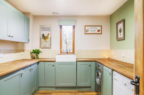 Handy utility room with Oak worktops...