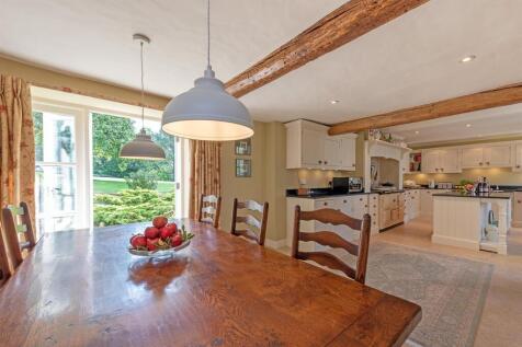 Kitchen in background and dining table.jpg