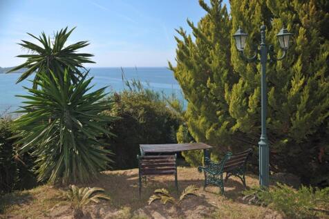 In the garden next to the sea