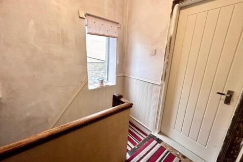 TO THE FIRST FLOOR LANDING